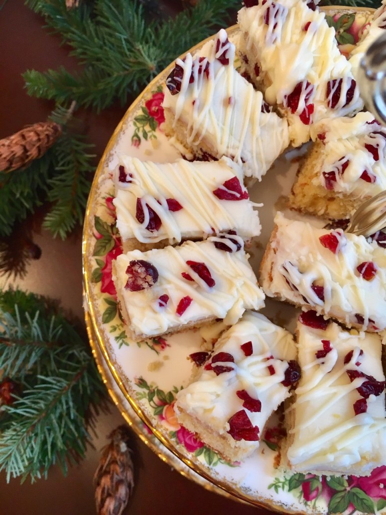Delicious cranberry bliss bars arranged on a plate.
