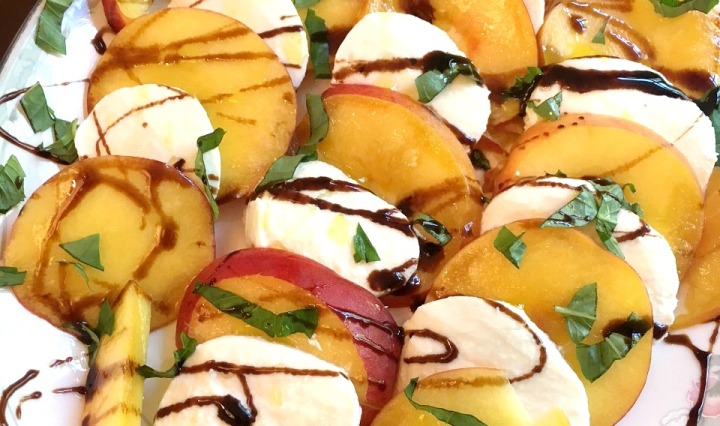 Large platter of peaches, fresh mozzarella slices and basil. Topped with balsamic glaze.