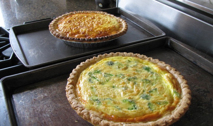 Two quiches cooling on the countertop.