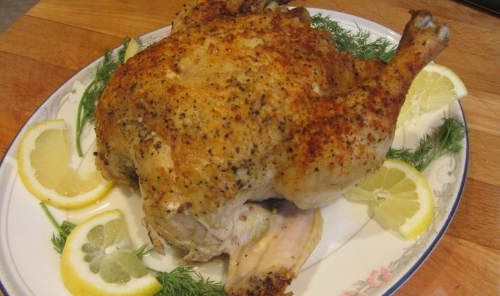 lemony slow cooker chicken. A whole chicken on a platter.